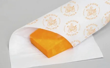 How Does Custom Greaseproof Paper Improve Food Packaging Quality?