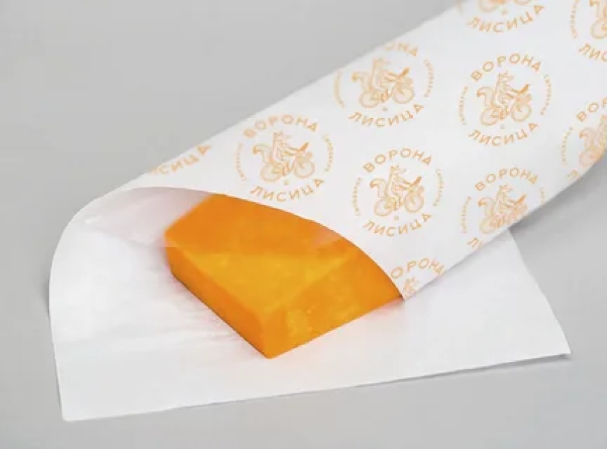 How Does Custom Greaseproof Paper Improve Food Packaging Quality?